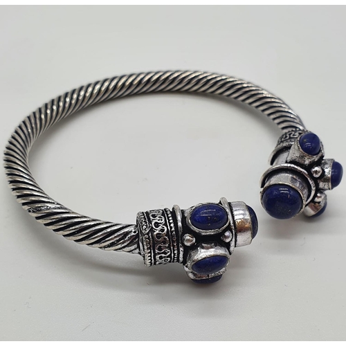 105 - A Tibetan silver and lapis lazuli necklace, earrings and bracelet in a presentation box. Necklace le... 