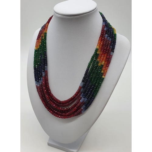 50 - A statement 7 row necklace with rubies, emeralds, sapphires and other precious stones of high qualit... 