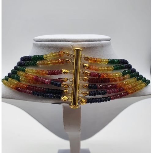 50 - A statement 7 row necklace with rubies, emeralds, sapphires and other precious stones of high qualit... 