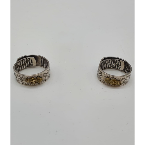 90 - A pair of HIS and HERS Feng Shui rings with a pixiu on the outer surface and Chinese characters on t... 