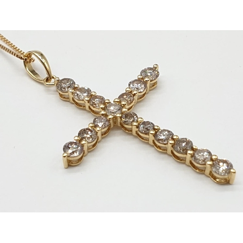 46 - 18ct yellow Gold and Diamond Cross .18ct Gold chain 46 cm 
 approx .Total of 1ct Diamonds.  Cross 3.... 