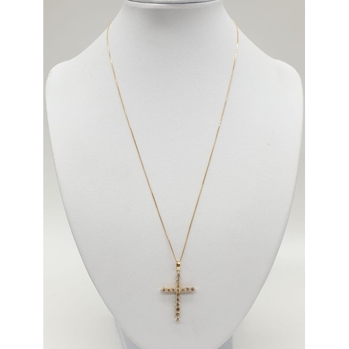 46 - 18ct yellow Gold and Diamond Cross .18ct Gold chain 46 cm 
 approx .Total of 1ct Diamonds.  Cross 3.... 