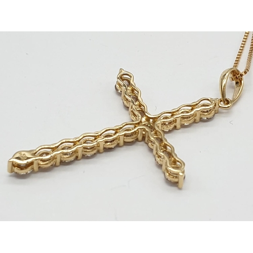 46 - 18ct yellow Gold and Diamond Cross .18ct Gold chain 46 cm 
 approx .Total of 1ct Diamonds.  Cross 3.... 