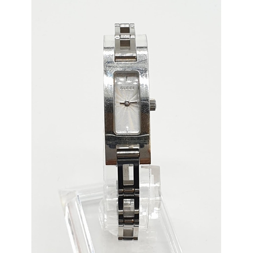 107 - Ladies Gucci stainless steel watch. Face width 1.5cm, height 3.5cm.