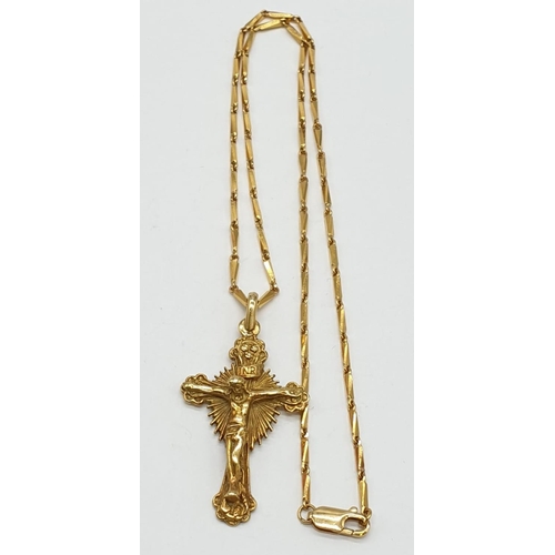 53 - 18ct yellow gold crucifix.18ct gold 42cm link chain, 19.4grams .Crucifix 2.5x4.5cm approx.