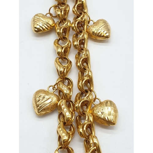 97 - 21ct yellow gold heart charm bracelet, weight 12.8g and 18cm long approx