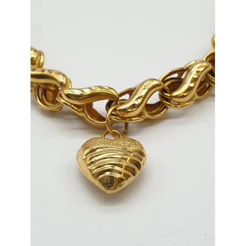 97 - 21ct yellow gold heart charm bracelet, weight 12.8g and 18cm long approx