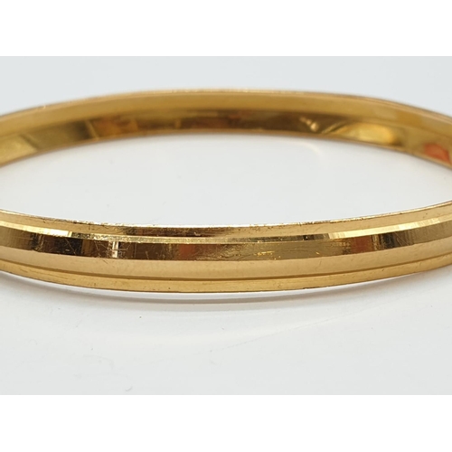 98 - 22ct yellow gold bangle, weight 21.3g and 7cm wide approx (A/F)