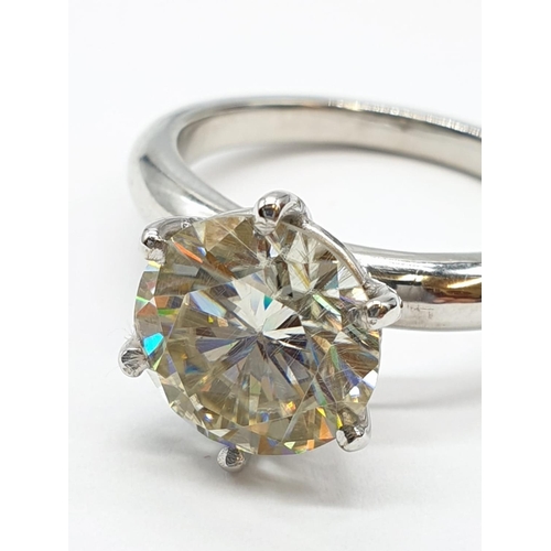 123 - 3.5ct White Moissanite diamond ring. Weight 5.44g, Size S.