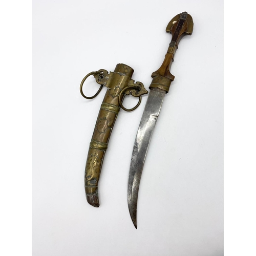 148 - Early 19th century Koummya North African, Arab dagger mounted in brass. 40cm long.