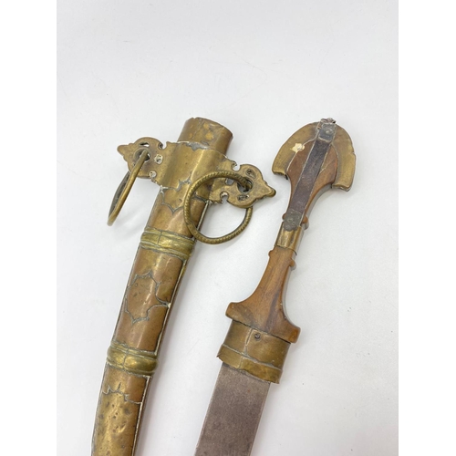 148 - Early 19th century Koummya North African, Arab dagger mounted in brass. 40cm long.