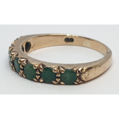 109 - 9ct Yellow gold emerald half eternity ring. Weight 2.8g, Size O.