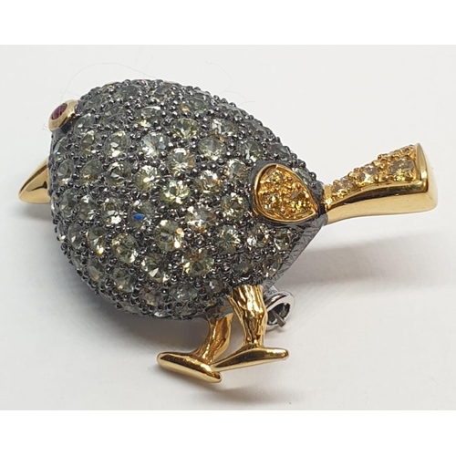 115 - 18ct Stone set bird brooch. Tail set with yellow diamonds. Weight 8.6g, Width 3.3cm.