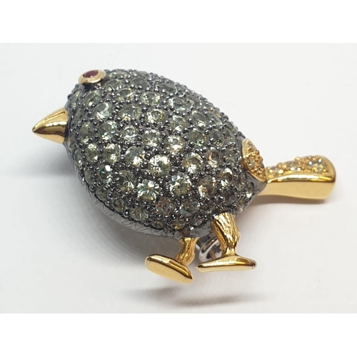 115 - 18ct Stone set bird brooch. Tail set with yellow diamonds. Weight 8.6g, Width 3.3cm.