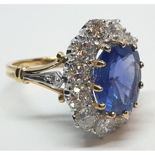 117 - 5.75ct sapphire ring set in white and yellow gold with over 3.5ct diamonds surrounding, weight 6.6g ... 