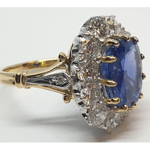 117 - 5.75ct sapphire ring set in white and yellow gold with over 3.5ct diamonds surrounding, weight 6.6g ... 