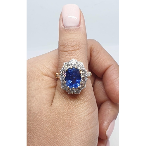 117 - 5.75ct sapphire ring set in white and yellow gold with over 3.5ct diamonds surrounding, weight 6.6g ... 