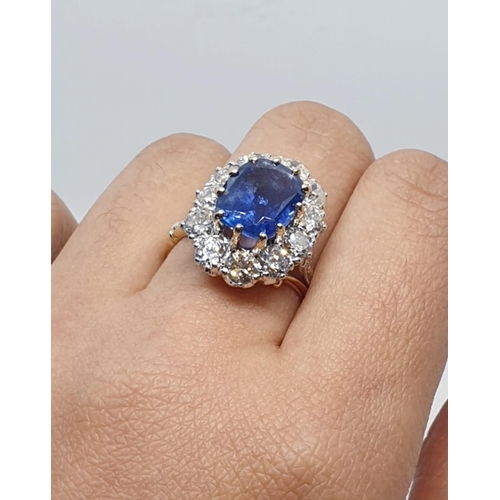 117 - 5.75ct sapphire ring set in white and yellow gold with over 3.5ct diamonds surrounding, weight 6.6g ... 