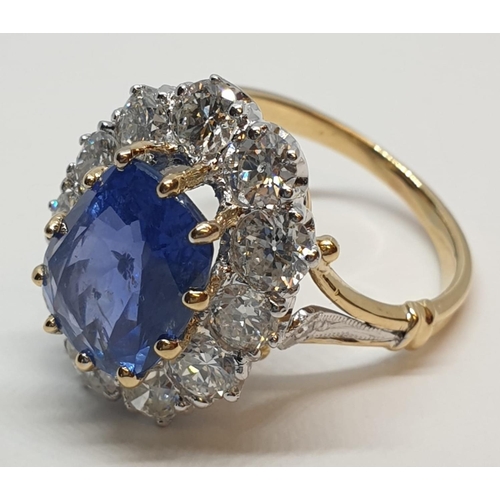 117 - 5.75ct sapphire ring set in white and yellow gold with over 3.5ct diamonds surrounding, weight 6.6g ... 