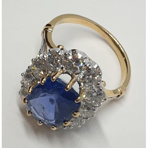 117 - 5.75ct sapphire ring set in white and yellow gold with over 3.5ct diamonds surrounding, weight 6.6g ... 