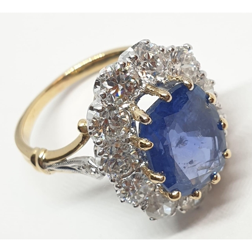 117 - 5.75ct sapphire ring set in white and yellow gold with over 3.5ct diamonds surrounding, weight 6.6g ... 