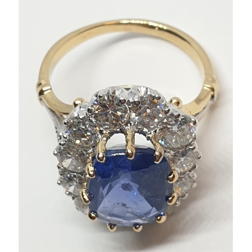 117 - 5.75ct sapphire ring set in white and yellow gold with over 3.5ct diamonds surrounding, weight 6.6g ... 