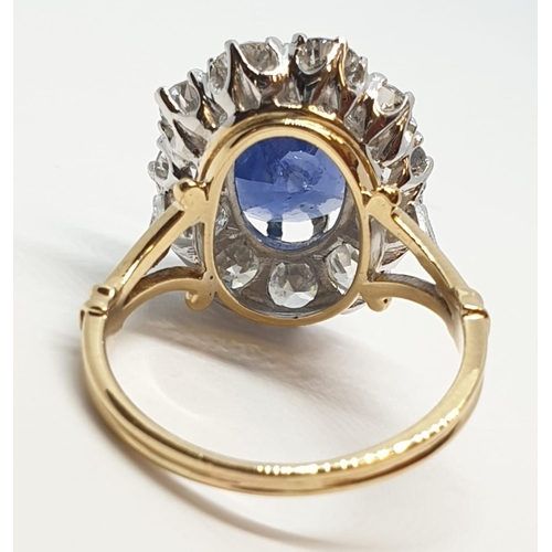 117 - 5.75ct sapphire ring set in white and yellow gold with over 3.5ct diamonds surrounding, weight 6.6g ... 