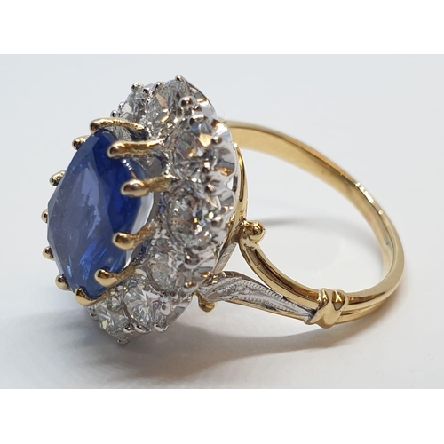 117 - 5.75ct sapphire ring set in white and yellow gold with over 3.5ct diamonds surrounding, weight 6.6g ... 