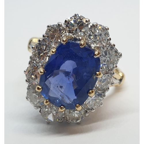 117 - 5.75ct sapphire ring set in white and yellow gold with over 3.5ct diamonds surrounding, weight 6.6g ... 