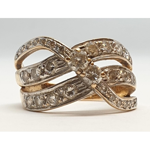 132 - 18ct Yellow gold diamond set fancy three row twist band ring. Weight 8.5g, Approx. 0.60ct of diamond... 