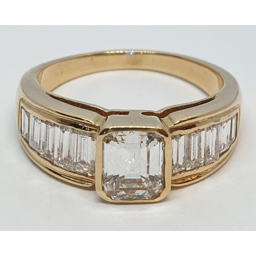 152 - Yellow gold ring with baguette cut diamonds, centre stone 0.85ct and further 0.50ct diamonds on each... 