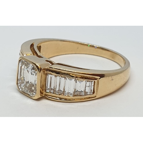 152 - Yellow gold ring with baguette cut diamonds, centre stone 0.85ct and further 0.50ct diamonds on each... 