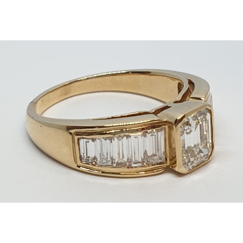 152 - Yellow gold ring with baguette cut diamonds, centre stone 0.85ct and further 0.50ct diamonds on each... 