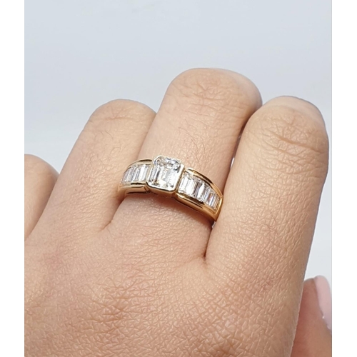 152 - Yellow gold ring with baguette cut diamonds, centre stone 0.85ct and further 0.50ct diamonds on each... 