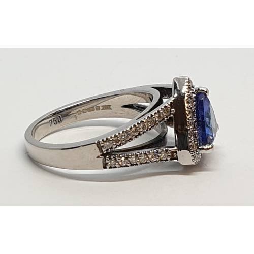 165 - 18CT WHITE GOLD RING WITH TRIANGULAR TANZANITE CENTRE AND DIAMONDS ON SHOULDERS, WEIGHT 7G AND SIZE ... 