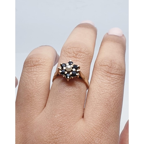 168 - 9ct Yellow gold sapphire and pearl cluster ring. Weight 2.8g, Size M.