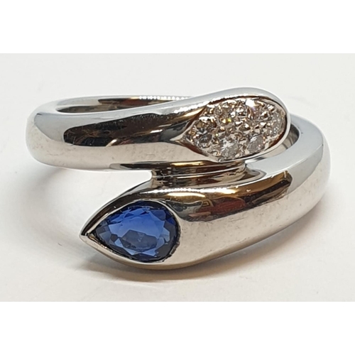 170 - Platinum cross over ring with 0.60ct Thai sapphire and 0.30ct encrusted diamonds, weight 13.7g and s... 