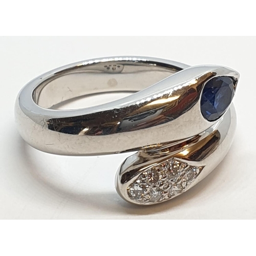 170 - Platinum cross over ring with 0.60ct Thai sapphire and 0.30ct encrusted diamonds, weight 13.7g and s... 