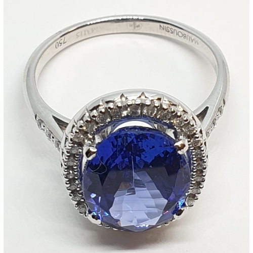 222 - 18ct white gold ring with 4ct tanzanite centre and encrusted diamond surrounding, weight 5.2g and si... 