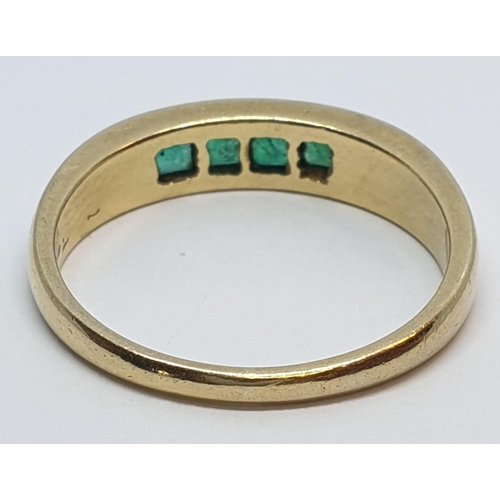 23 - 18ct Yellow gold emerald set band ring. Weight 3.8g, Size O.