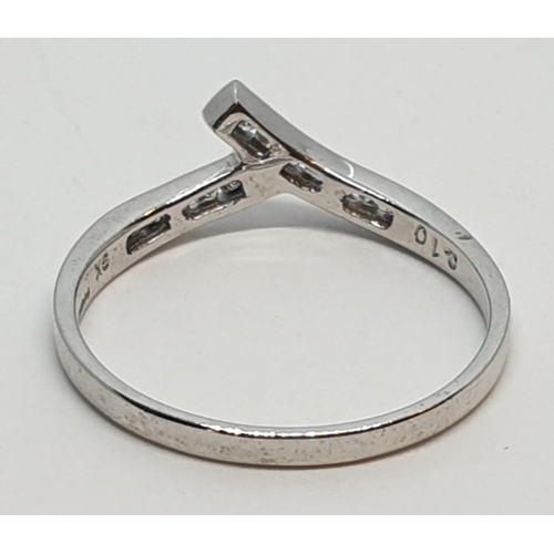 233 - 9ct White gold diamond set twist band ring. Weight 1.2g, Approx. 0.10ct of diamond, Size L.