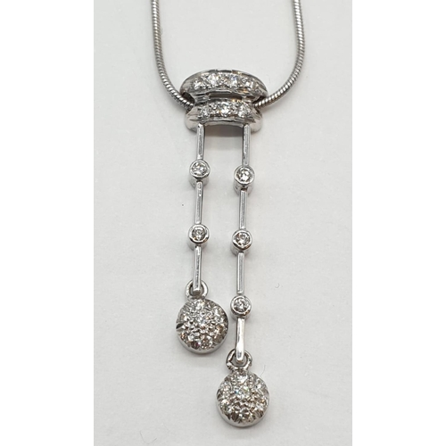 25 - 18ct White gold diamond set drop pendant on 18ct white gold snake chain. Weight 7.7g, Length 22cm.