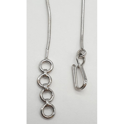 25 - 18ct White gold diamond set drop pendant on 18ct white gold snake chain. Weight 7.7g, Length 22cm.