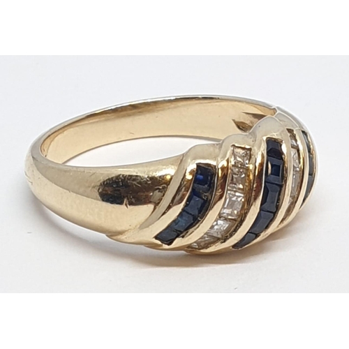 38 - 14ct Yellow gold diamond and sapphire ring. Weight 4.2g, Size N.