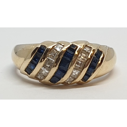 38 - 14ct Yellow gold diamond and sapphire ring. Weight 4.2g, Size N.