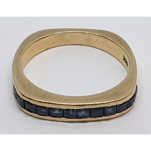 55 - 18ct Yellow gold sapphire set band ring. Weight 4.2g, Size K.