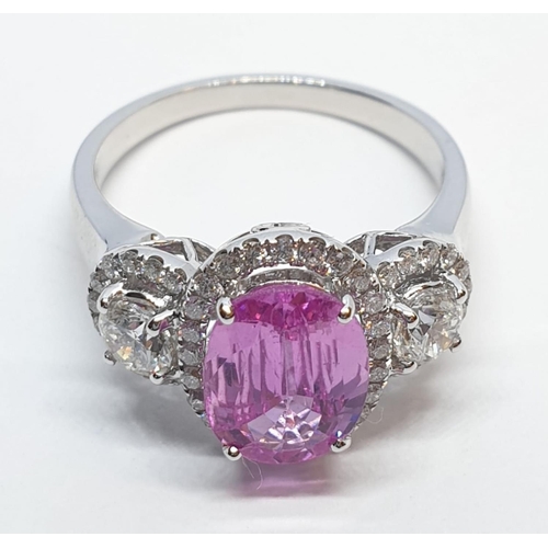 77 - 18ct white gold ring with 2.2ct oval pink sapphire centre and 0.50ct brilliant diamond on each shoul... 