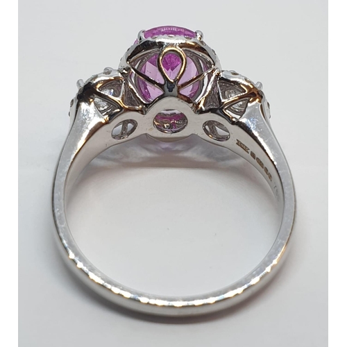 77 - 18ct white gold ring with 2.2ct oval pink sapphire centre and 0.50ct brilliant diamond on each shoul... 