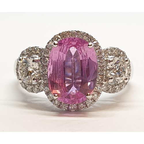 77 - 18ct white gold ring with 2.2ct oval pink sapphire centre and 0.50ct brilliant diamond on each shoul... 