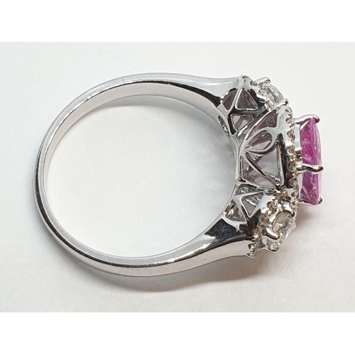 77 - 18ct white gold ring with 2.2ct oval pink sapphire centre and 0.50ct brilliant diamond on each shoul... 